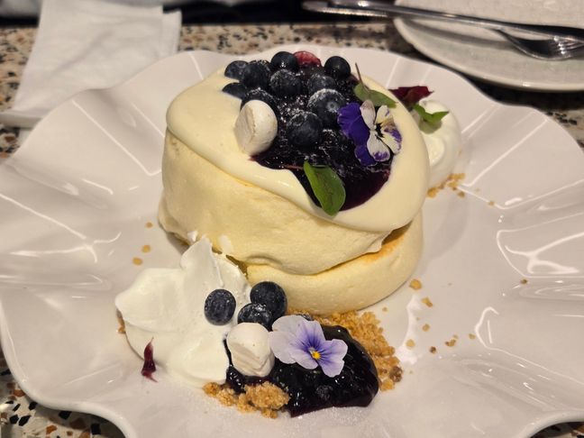 Japanese-style souffle pancake with blueberry jam, and cheese cream.