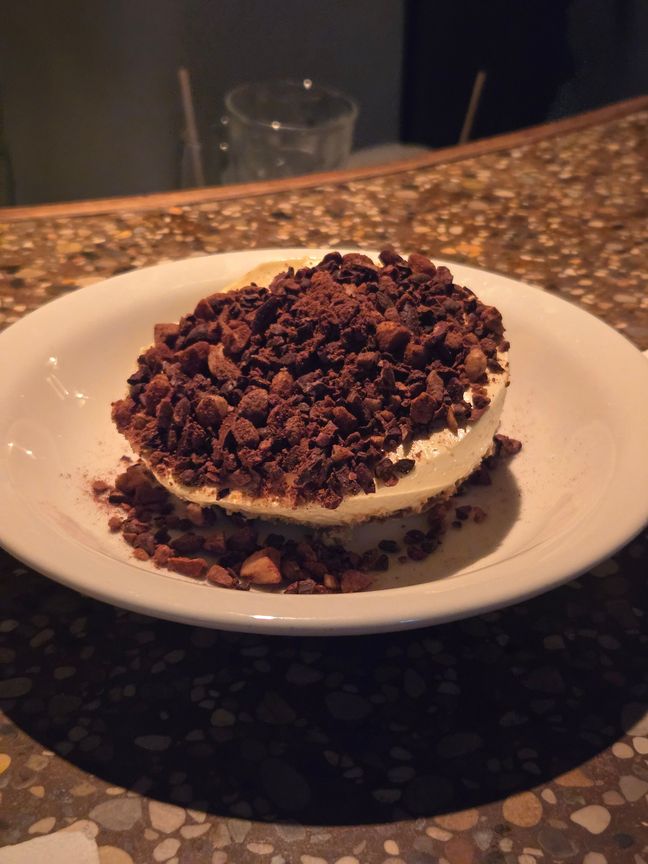 Unauthentic tiramisu with chocolate bits on top.