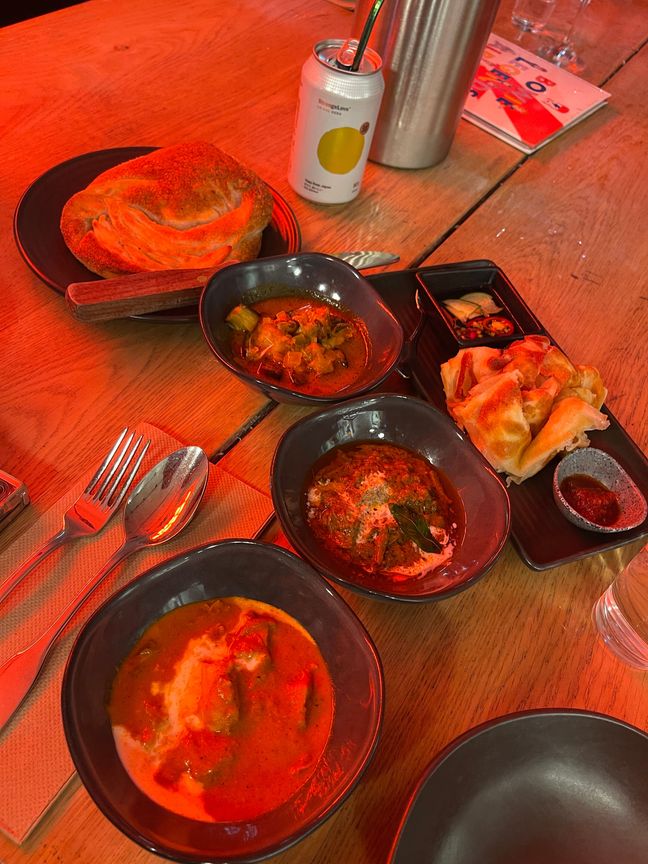 Different types of roti with curry for dipping